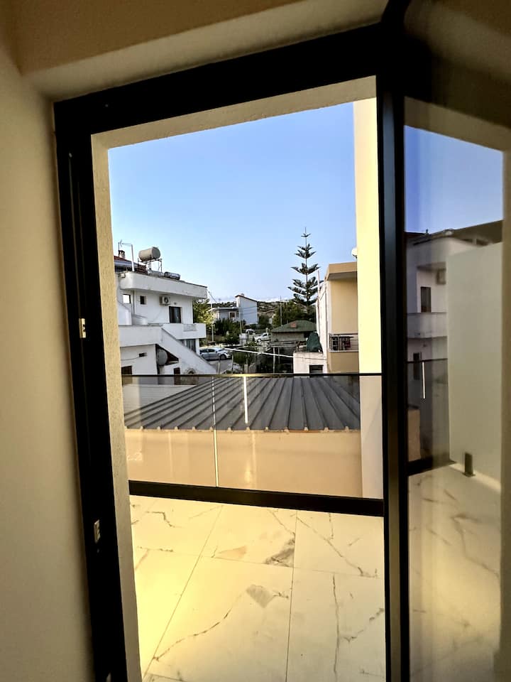 Full-height window with a quiet view over the neighbourhood